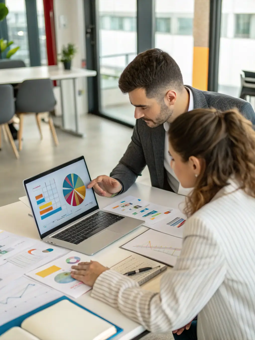 A consultant deeply engaged in discussion with a client, reviewing data and charts related to water sustainability projects, set in a modern office environment.